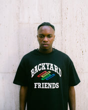 Load image into Gallery viewer, Oversized College Logo T-Shirt on body, portrait of man wearing