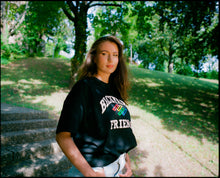 Load image into Gallery viewer, Oversized College Logo T-Shirt on body, portrait of woman wearing outside